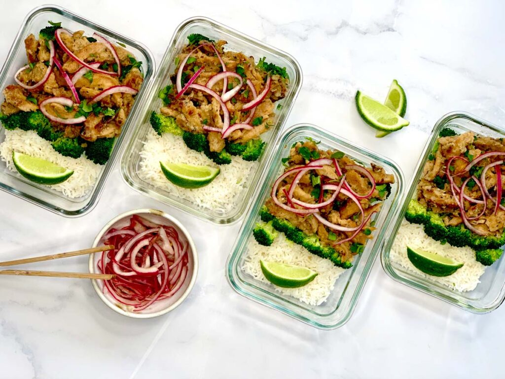 coconut lime soy curl meal prep containers with side of pickled red onion. 