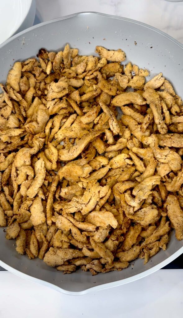 browned soy curls in frying pan 